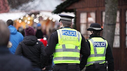 Police standing outside a fair